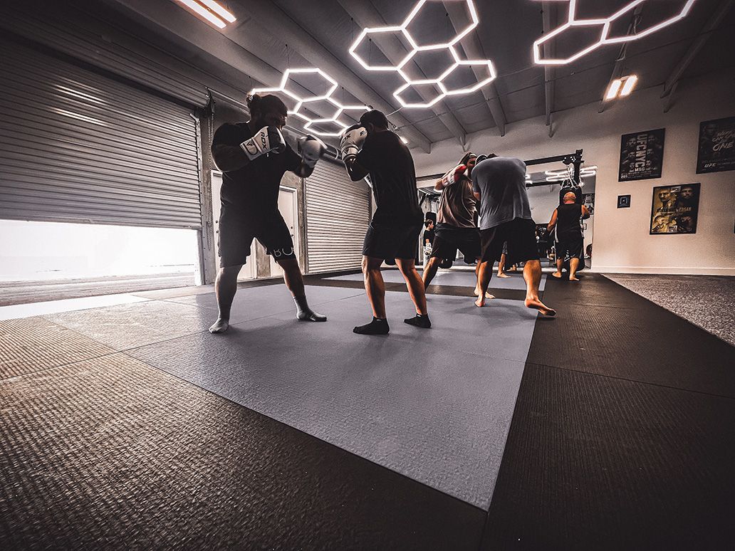 Members sparring during boxing class